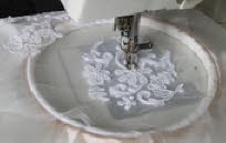 Freehand embroidering the lace design